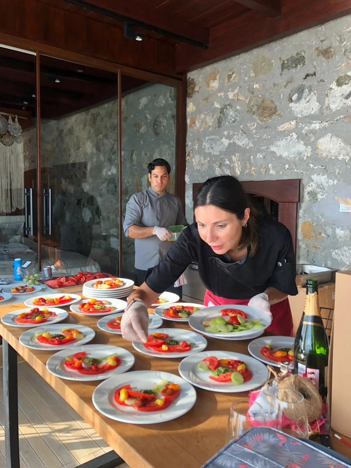 Chef Birnur plating in a villa kitchen
