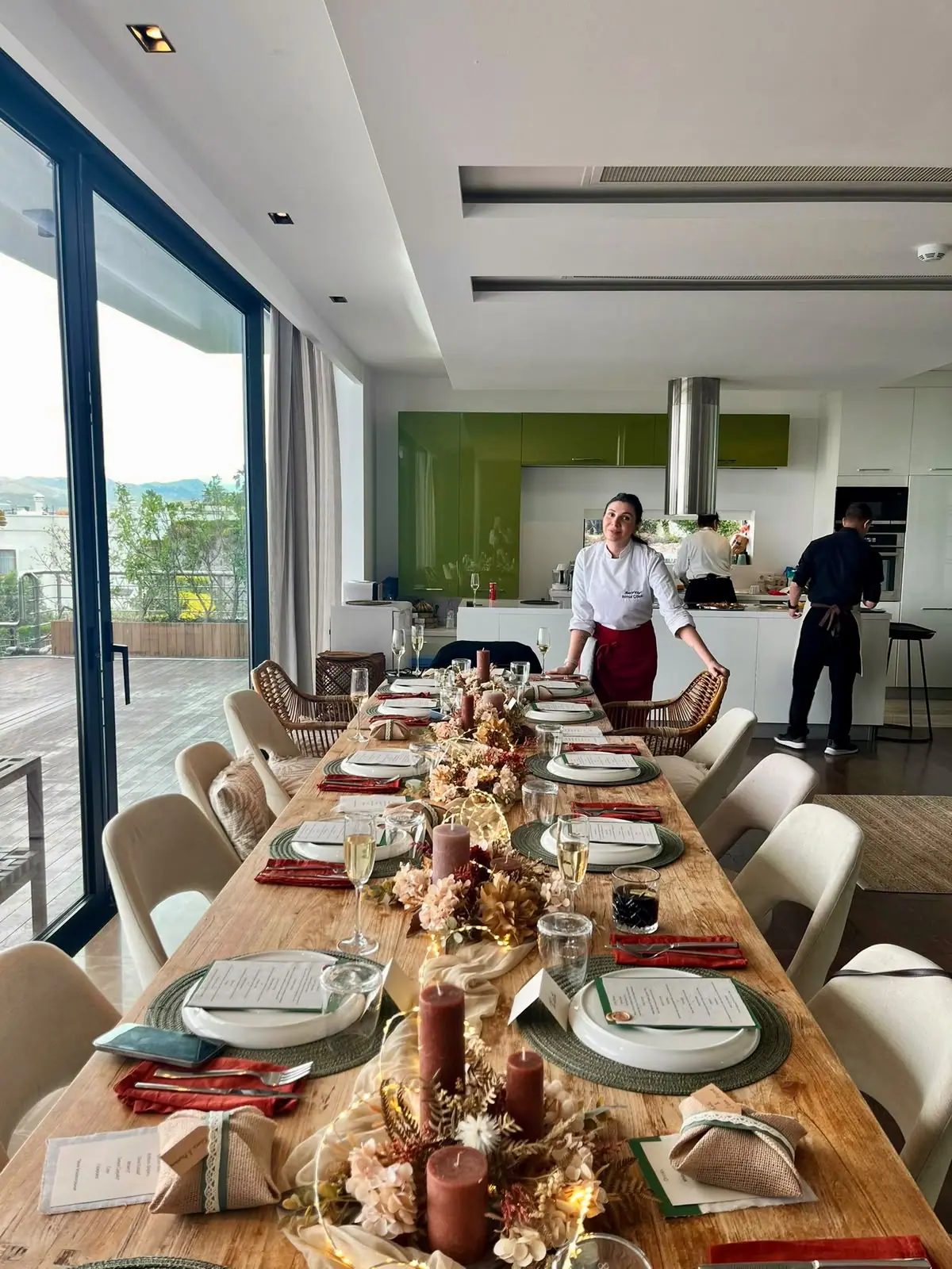 Long dinner table set in a villa living room