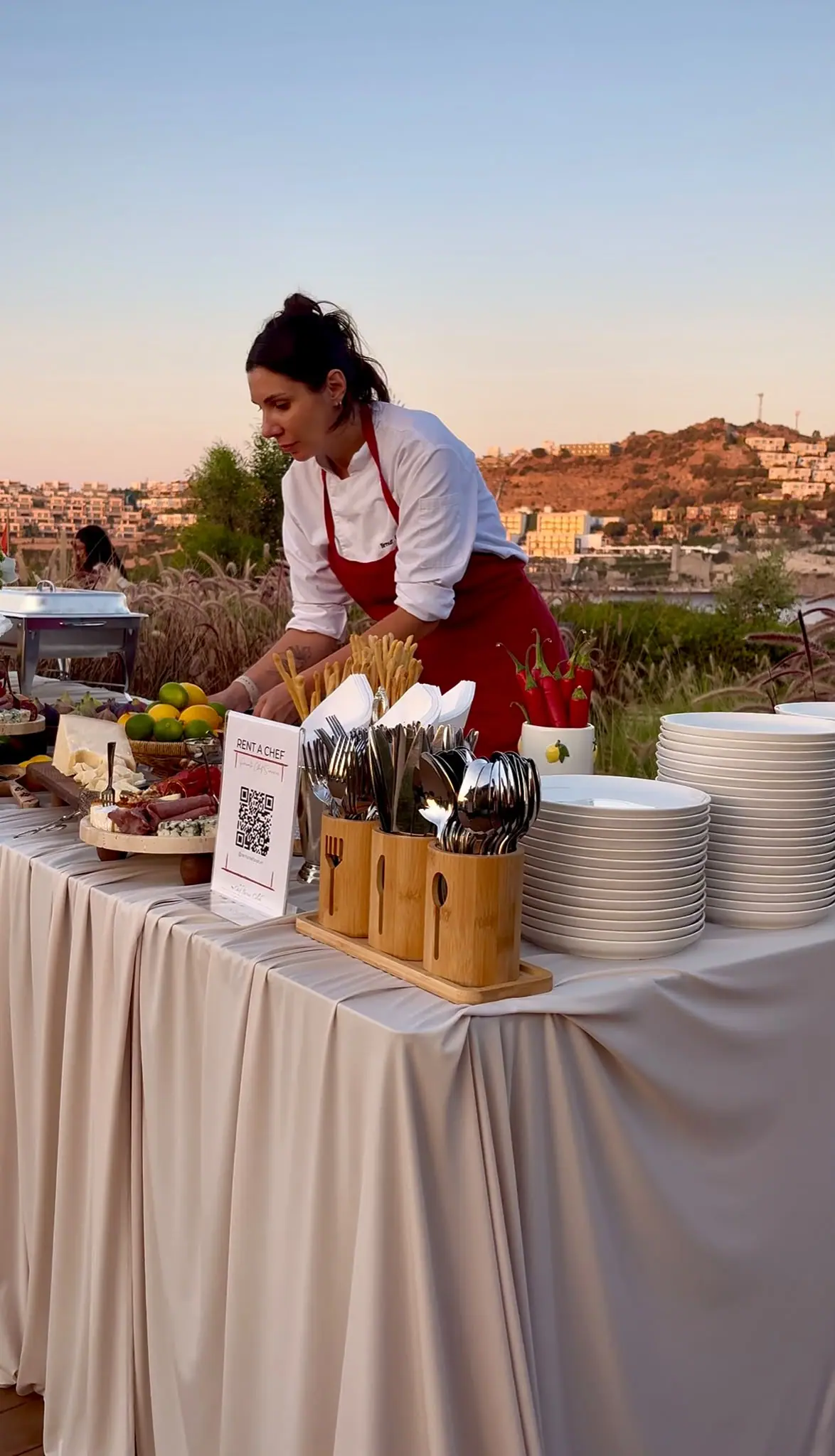 Chef Birnur at a service station at sunset